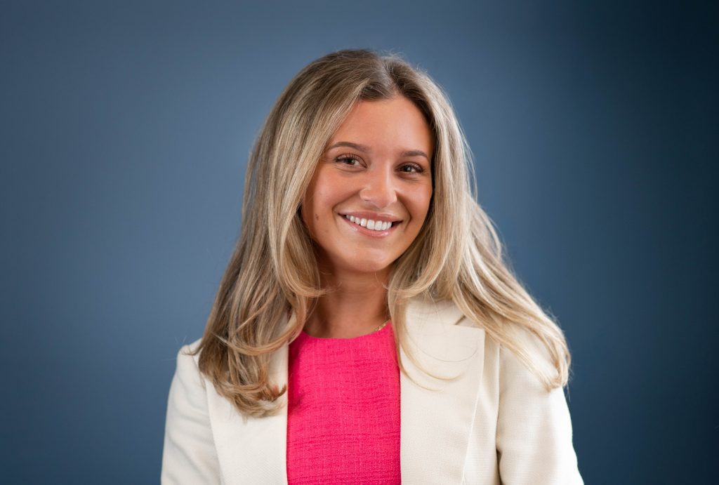 Woman smiling at the camera.