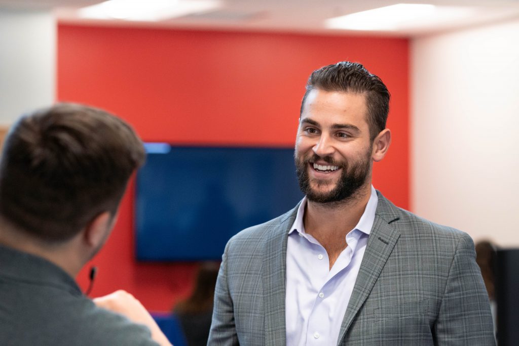 Man smiling at the camera.