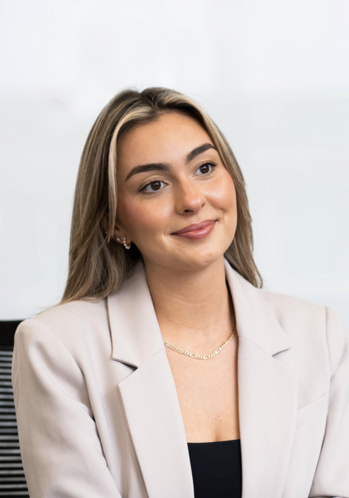 Woman smiling at the camera.