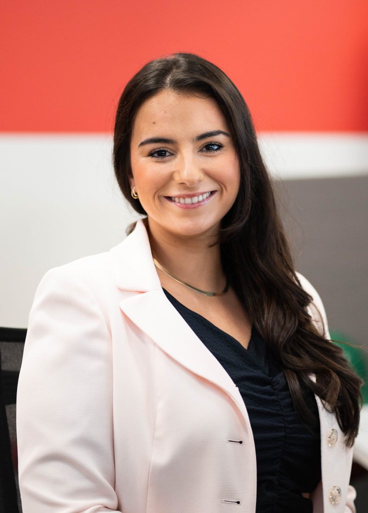 Woman smiling at the camera.