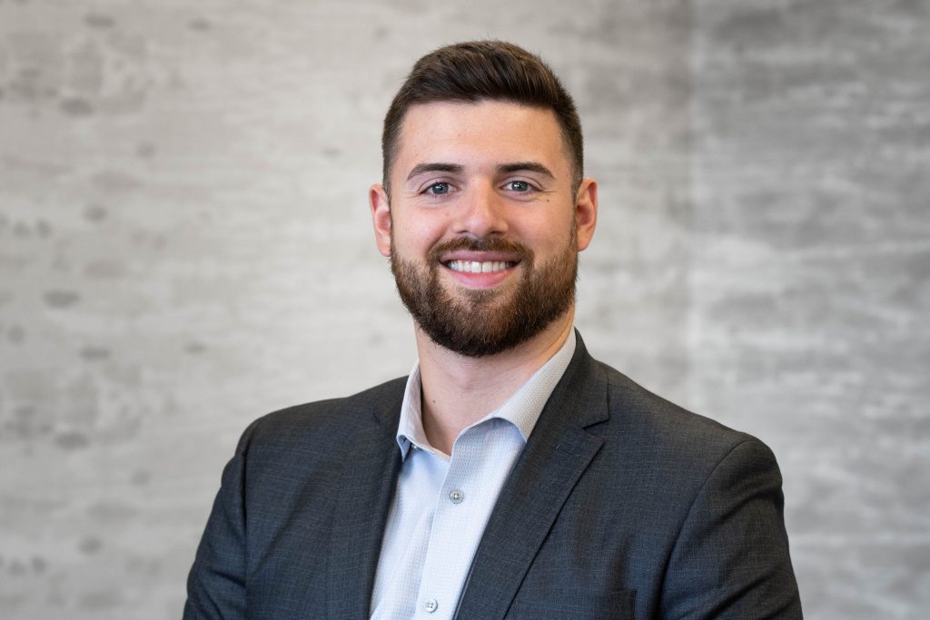 Man smiling at the camera.