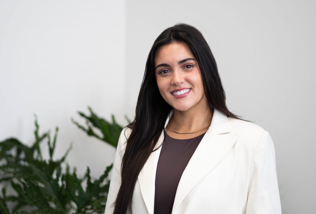 Woman smiling at the camera.