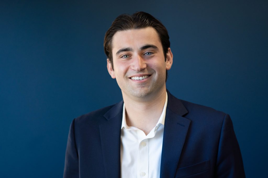 Man smiling at the camera.