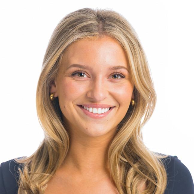 Woman smiling at the camera.