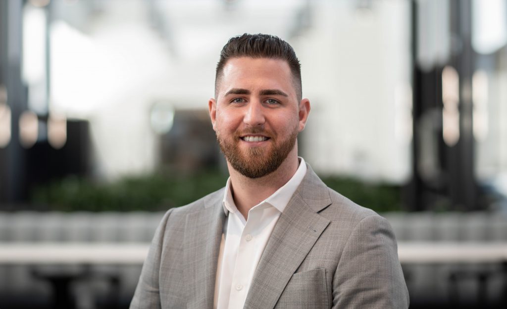 Man smiling at the camera.