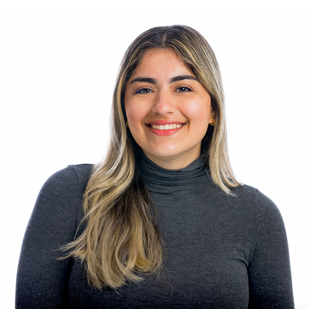 Woman smiling at the camera.