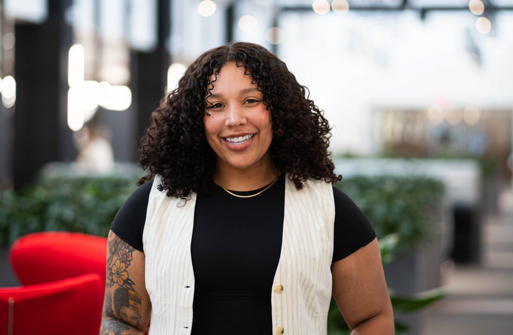 Woman smiling at the camera.