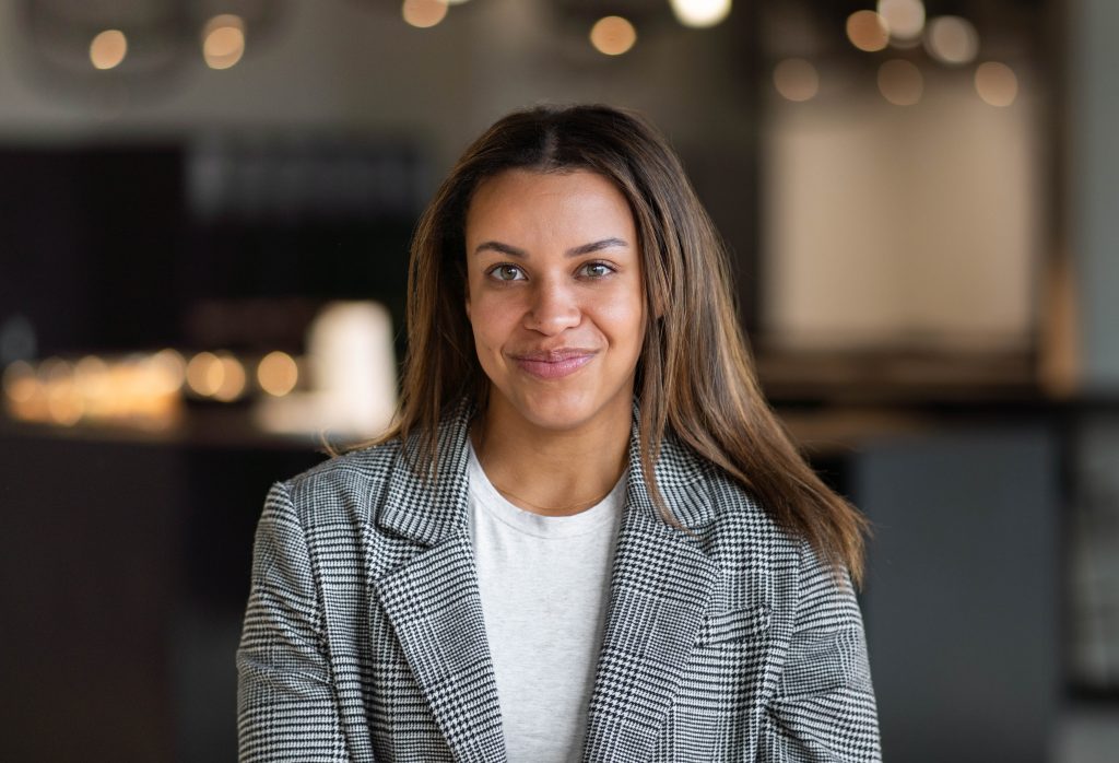 Woman smiling at the camera.