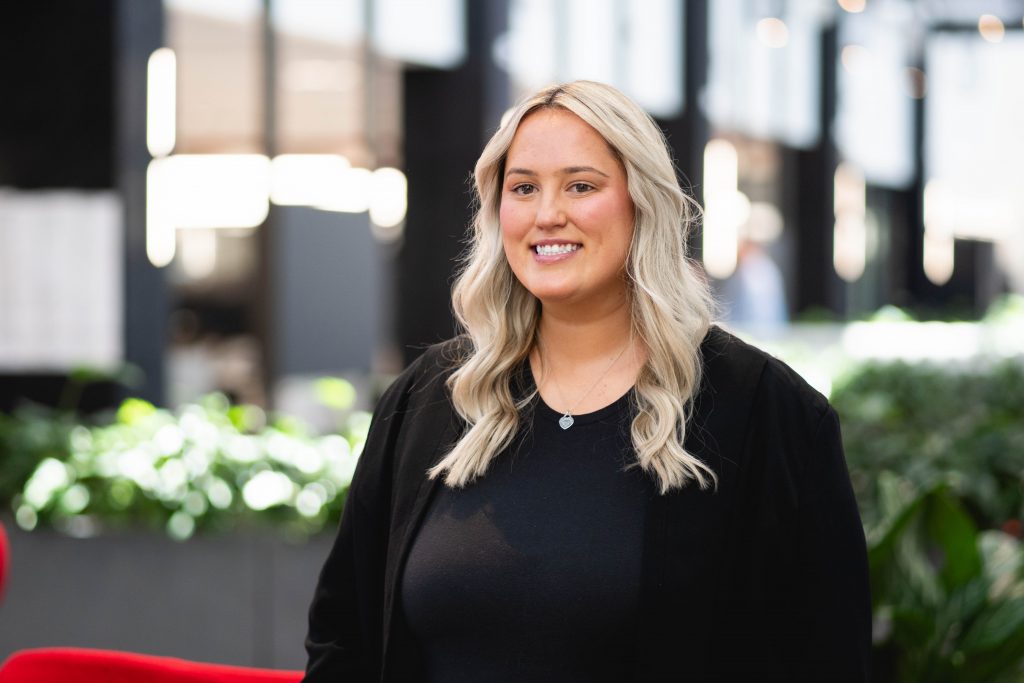 Woman smiling at the camera.