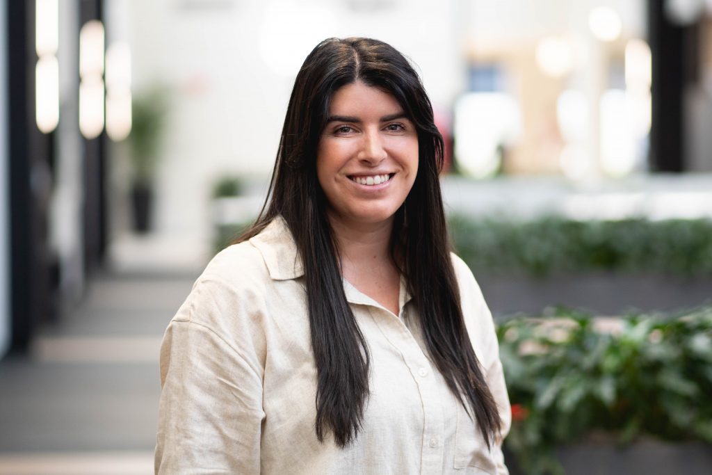Woman smiling at the camera.