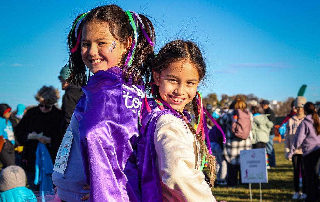 Two girls smiling at the camera.