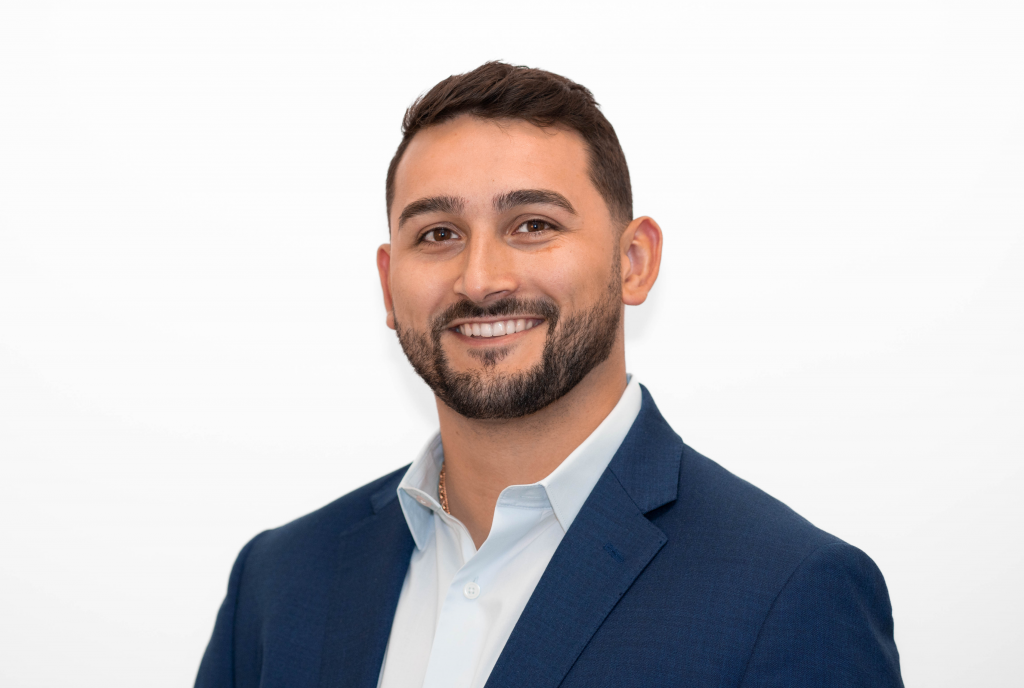 Man smiling at the camera.